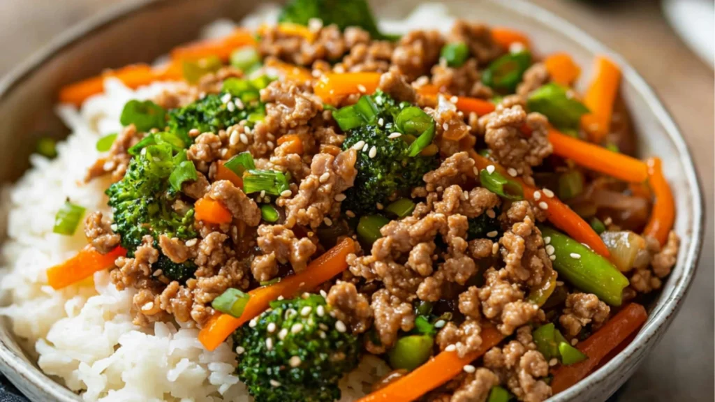 a close up of a plate of food with rice and broccoli in it