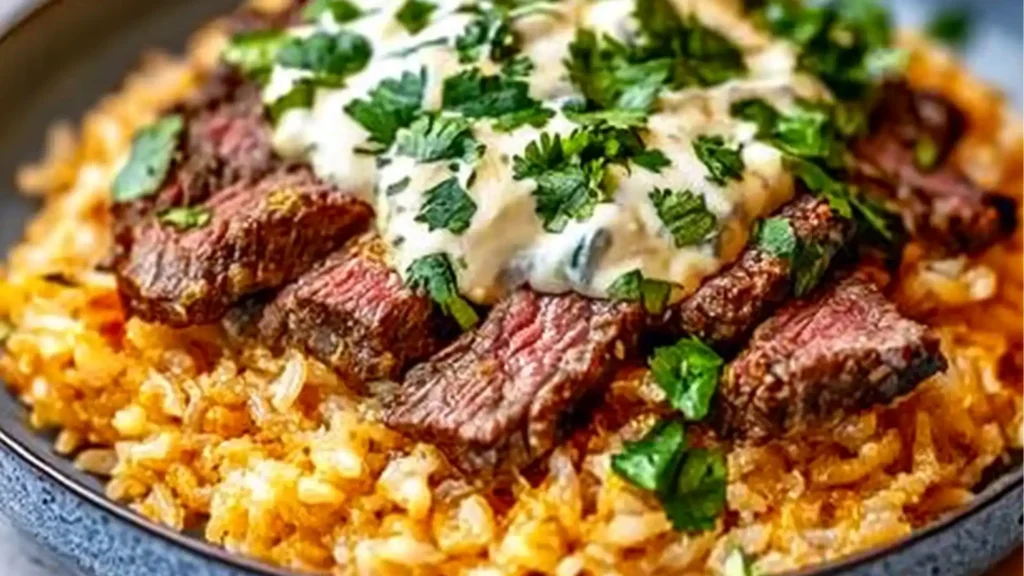 steak and queso rice in a skillet with the words steak and queso rice above it