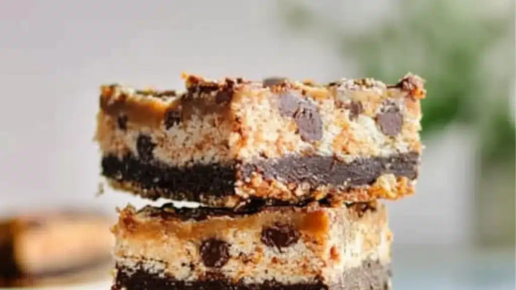 pieces of chocolate and marshmallow bars stacked on top of eachother