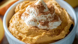 pumpkin fluff dip with apples and crackers on the side is an easy fall appetizer