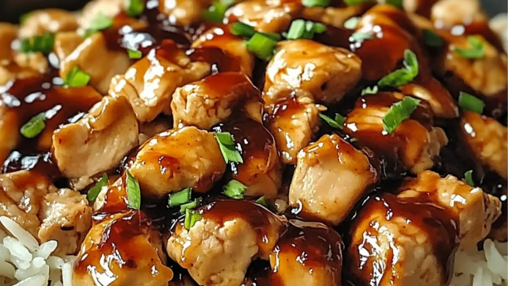 honey bbq chicken rice in a black bowl