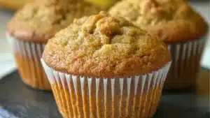 pumpkin bread muffins on a cutting board with the words perfectly moist - pumpkin bread minis