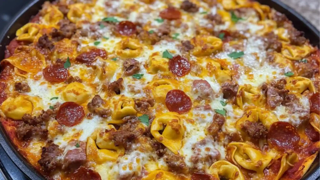 pizza and tortellini are being cooked in a skillet on the stove top