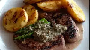 irish steaks with whiskey cream on a white plate