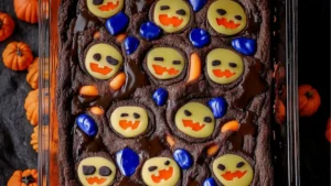 a chocolate cake decorated with frosting and candies