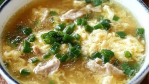 an egg drop soup recipe in a bowl with the words zero care egg drop soup
