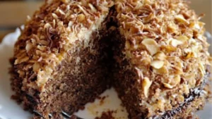 the best german chocolate cake is cut in half and served on a plate with one slice taken out