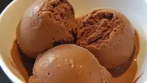 chocolate greek frozen yogurt is on a plate with the words easy healthy ice cream
