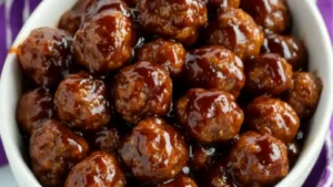two bowls filled with meatballs covered in sauce