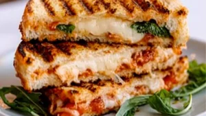grilled chicken parm panini on a white plate