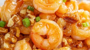 some food that is on top of a plate with chopsticks in it and the words, 30 min easy honey walnut shrimp