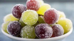 two bowls filled with colorful candies and the words kool - aid grapes above them