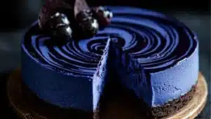 the blueberry cheesecake is ready to be eaten and served on black plates with text overlay