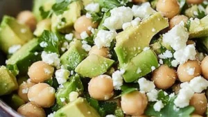 a salad with chickpeas, avocado and feta cheese