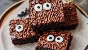 a cake in a box with chocolate frosting and sprinkles on it