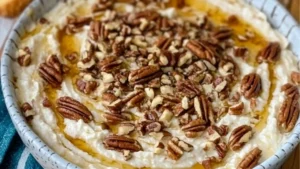 whipped parmesan and honey pecan cheese dip on top of mashed potatoes
