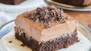 mexican chocolate milk cake is being drizzled with icing on a plate