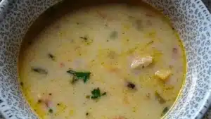 two bowls filled with soup and one bowl full of soup in the middle, on top of