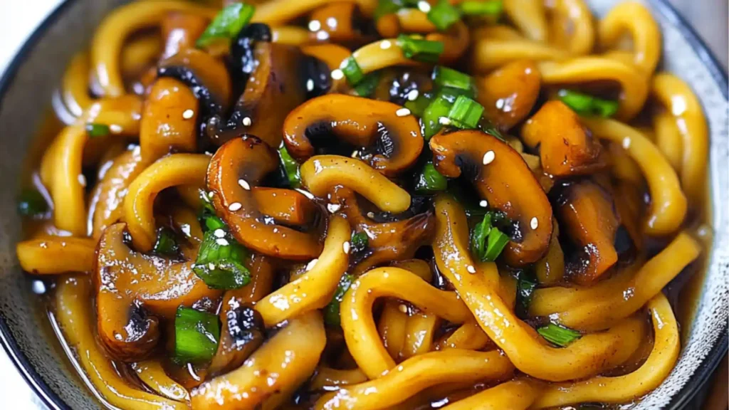 picture showing food in a bowl, with noodles and Mushrooms