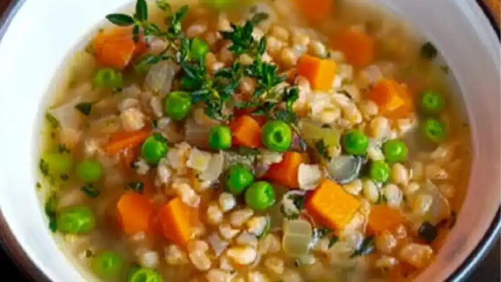 two bowls of vegetable barley soup with the title easy vegan vegetables and barley soup
