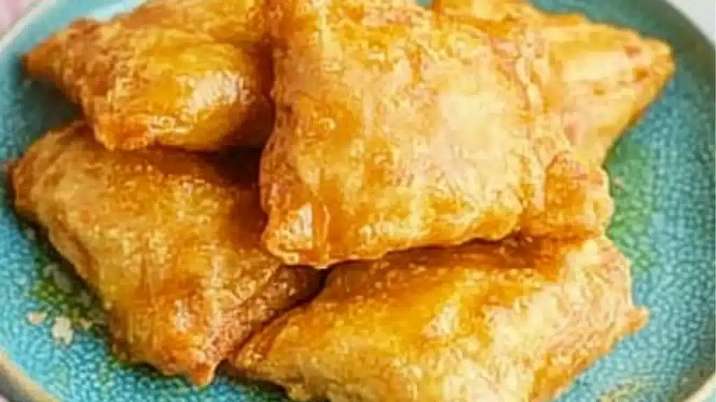 some food is stacked on top of each other with the words super easy crispy chile rellens made with egg roll wrappers