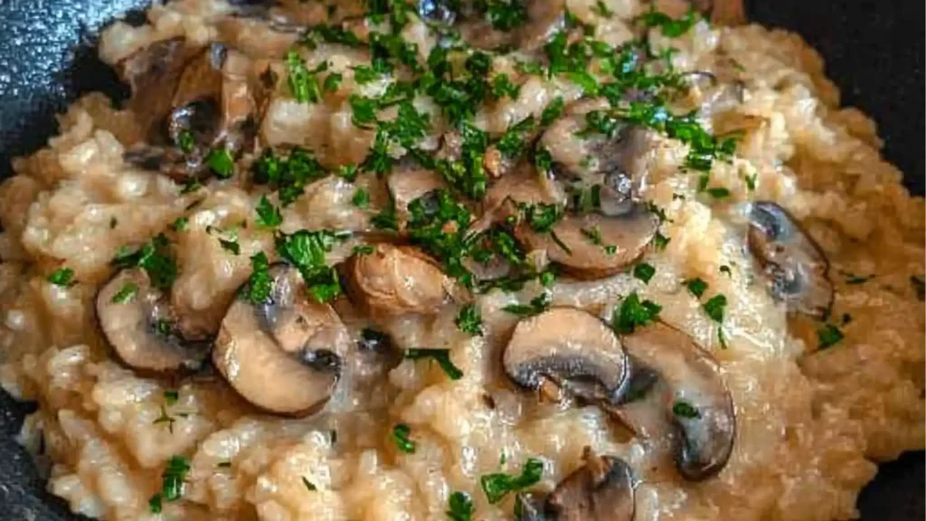 creamy mushroom risotto in a bowl with parmesan cheese