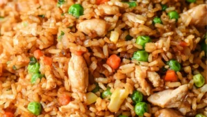 chicken fried rice in a white bowl with the words, 30 min better than take out chinese