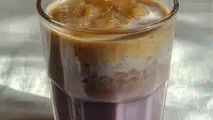 homemade taro latte recipe with lavender flowers in the background