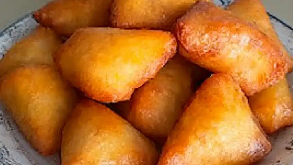 an easy mandazi recipe is shown with the words, easy mandazi a kenyan treat