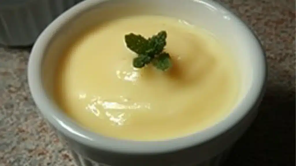a bowl filled with vanilla pudding next to another bowl full of whipped cream and the words, carnivore vanilla pudding