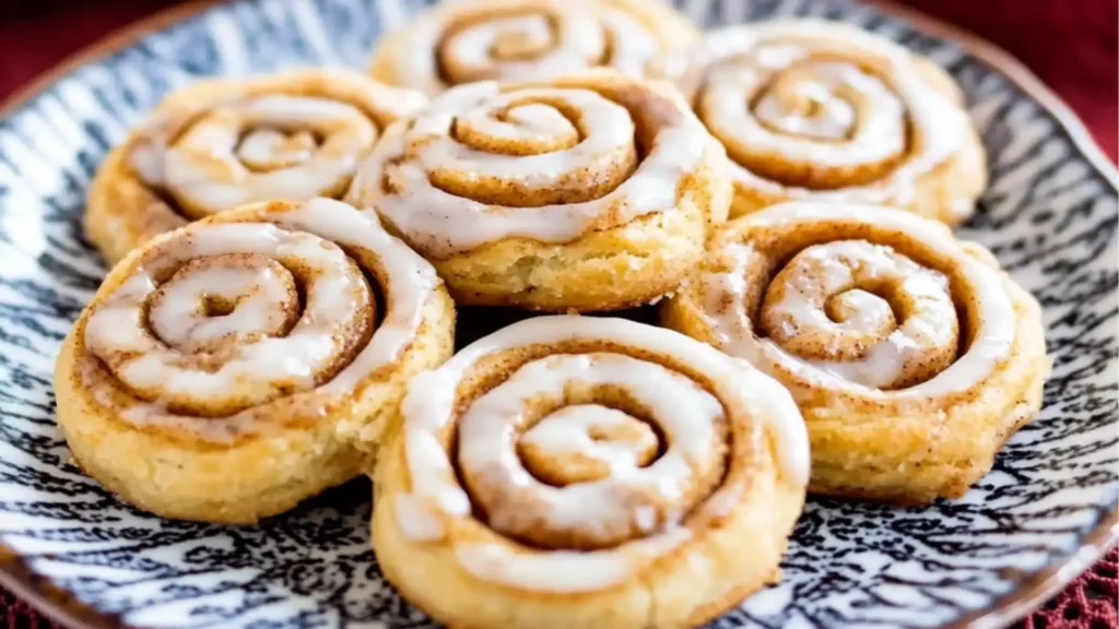 several different types of cinnamon roll cookies on plates