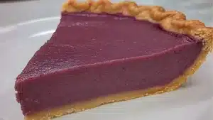 a purple sweet potato pie on a plate with the words black folks written below it