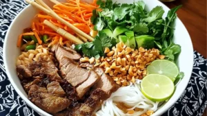 this vietnamese noodle bowl is loaded with vegetables, meats and herbs for a healthy lunch