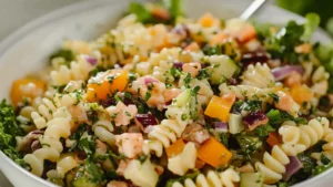 picture of pasta and vegetables in them, one has cheese on top