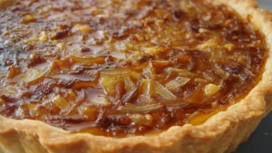 an onion tart with cheese and parsley on top is shown in two different views