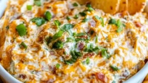 a glass bowl filled with food and the words 5 minute million dollar dip