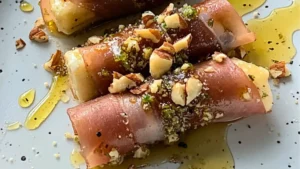 crispy prosciutto wrapped bourbon with honey and chopped nuts