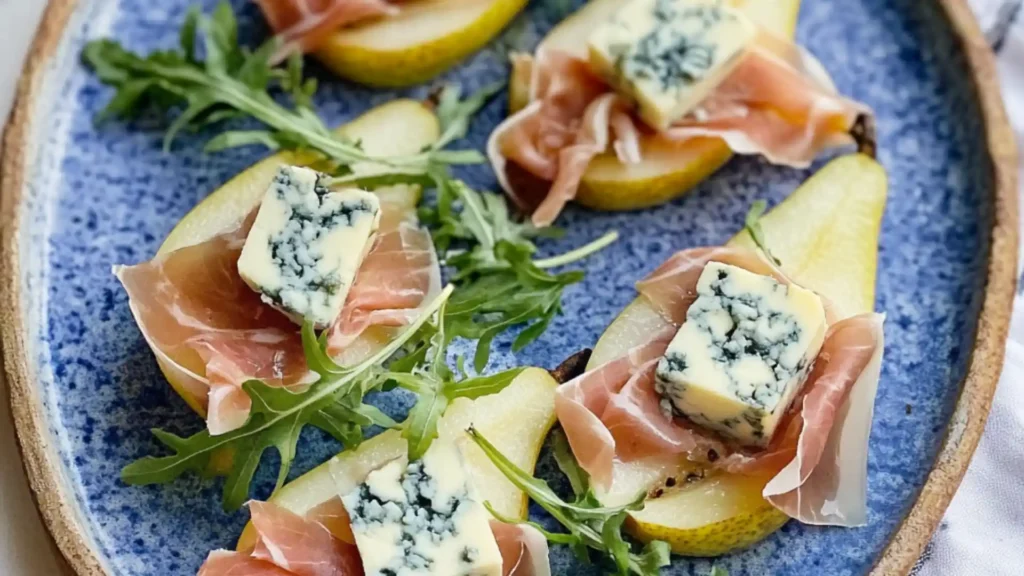 pears and prosciutto with blue cheese on them