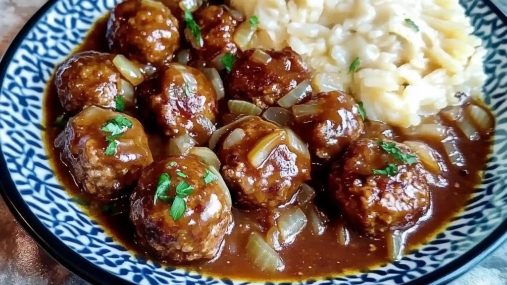 crock pot french onion meatballs in a slow cooker with text overlay