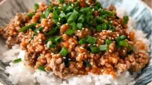 plate filled with rice, meat and veggies next to the words 20 minute bang bang turkey rice bowls