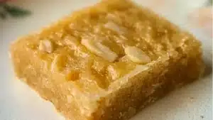 Close up image of Dutch Almond Bars on a blue and white plate with text overlay.