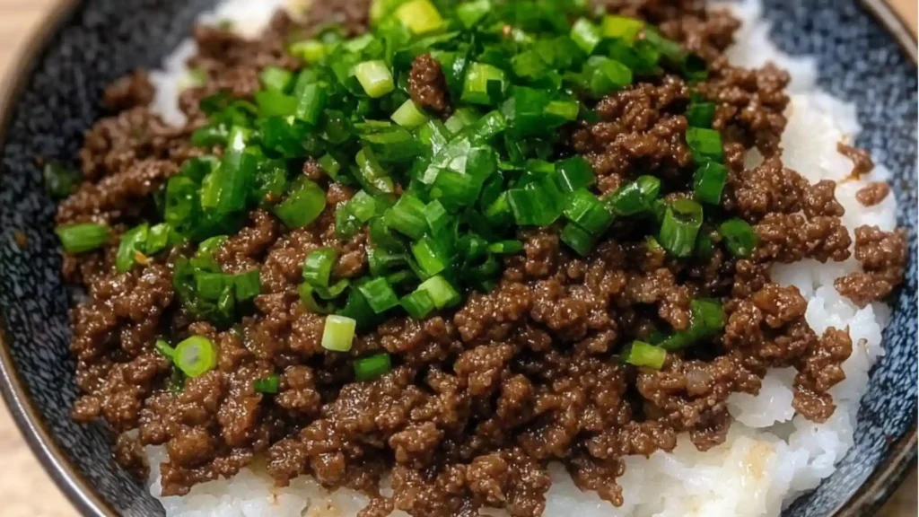 korean ground beef bowl with rice and green onions