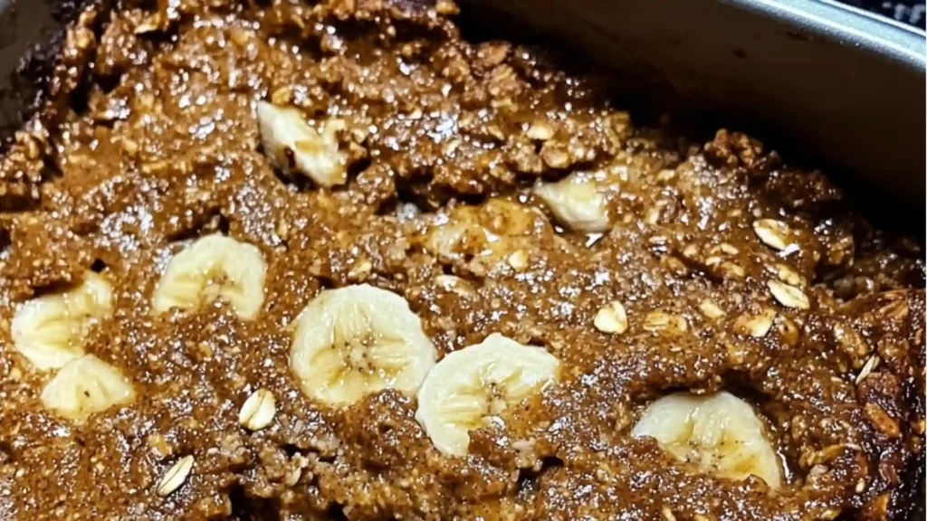 a banana baked oatmeal in a glass baking dish