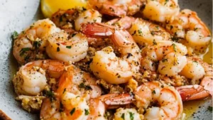 the shrimp is being cooked in a skillet and garnished with parsley