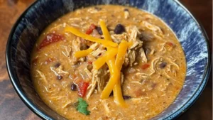 bowl of cheesy chicken fajita soup with tortilla chips