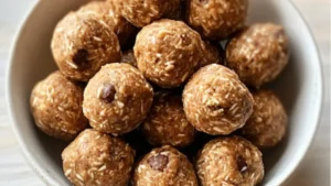 the best energy oatmeal balls in a glass bowl with chocolate chips and peanut butter