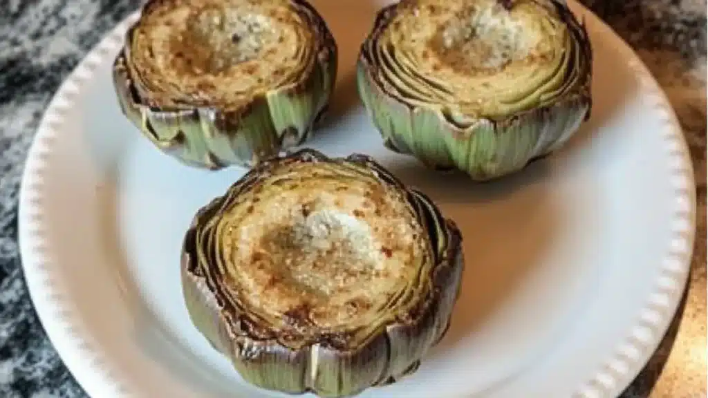 some food is sitting on a white plate