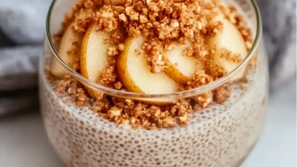 an apple crumble chia pudding in a glass bowl