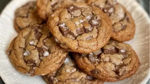 several cookies stacked on top of each other with chocolate chips and caramel chunks in the middleseveral cookies stacked on top of each other with chocolate chips and caramel chunks in the middle