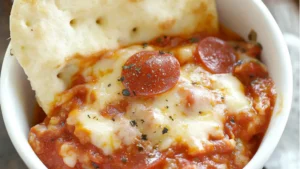 the ultimate crockpot pizza dip is ready to be eaten
